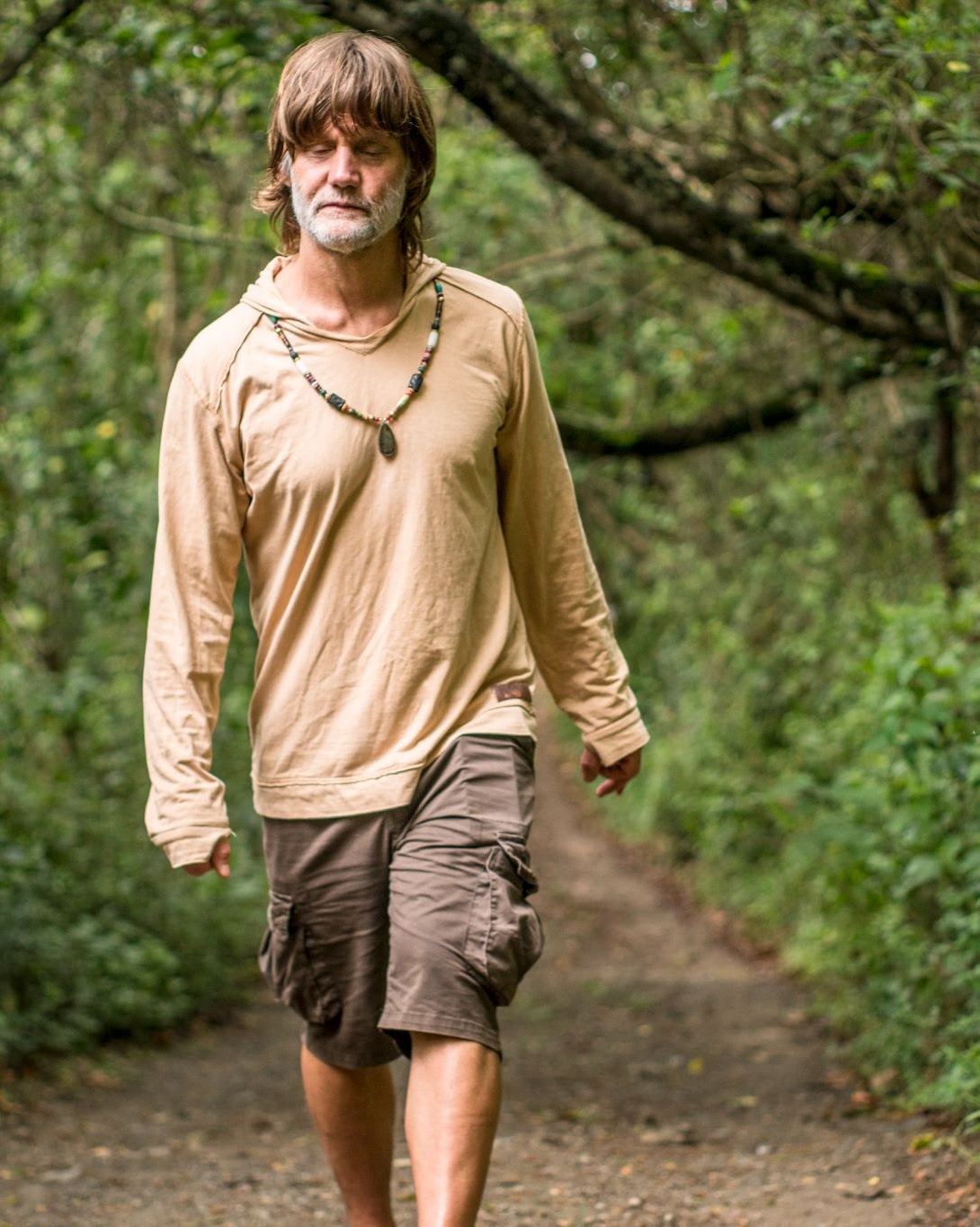 Yash walking on a forest path.